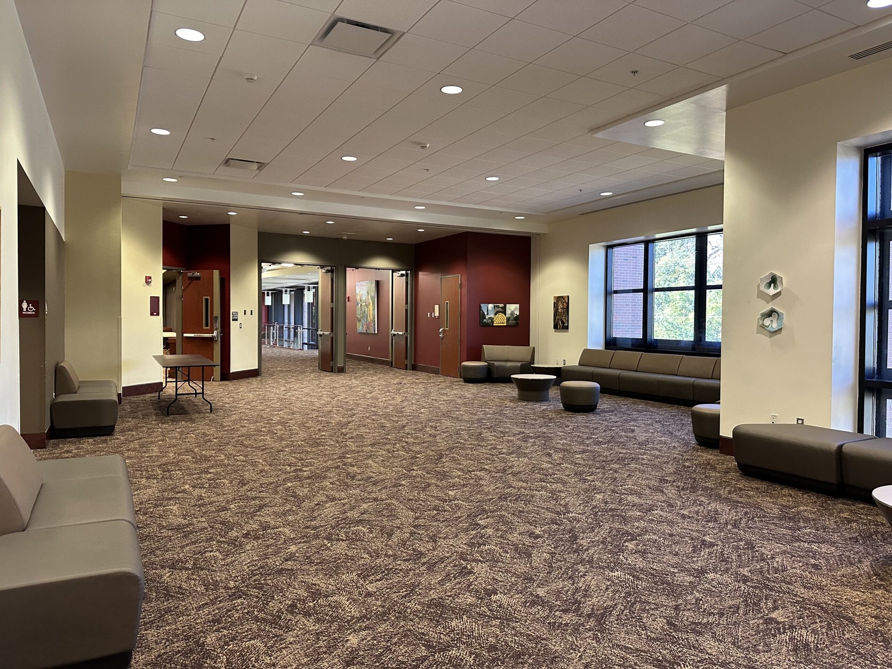Atrium lounge and reception area with seating along the windows